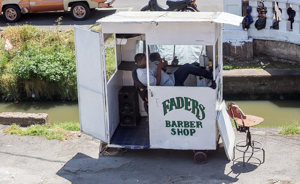 Barber at the market, Georgetown, Guyana